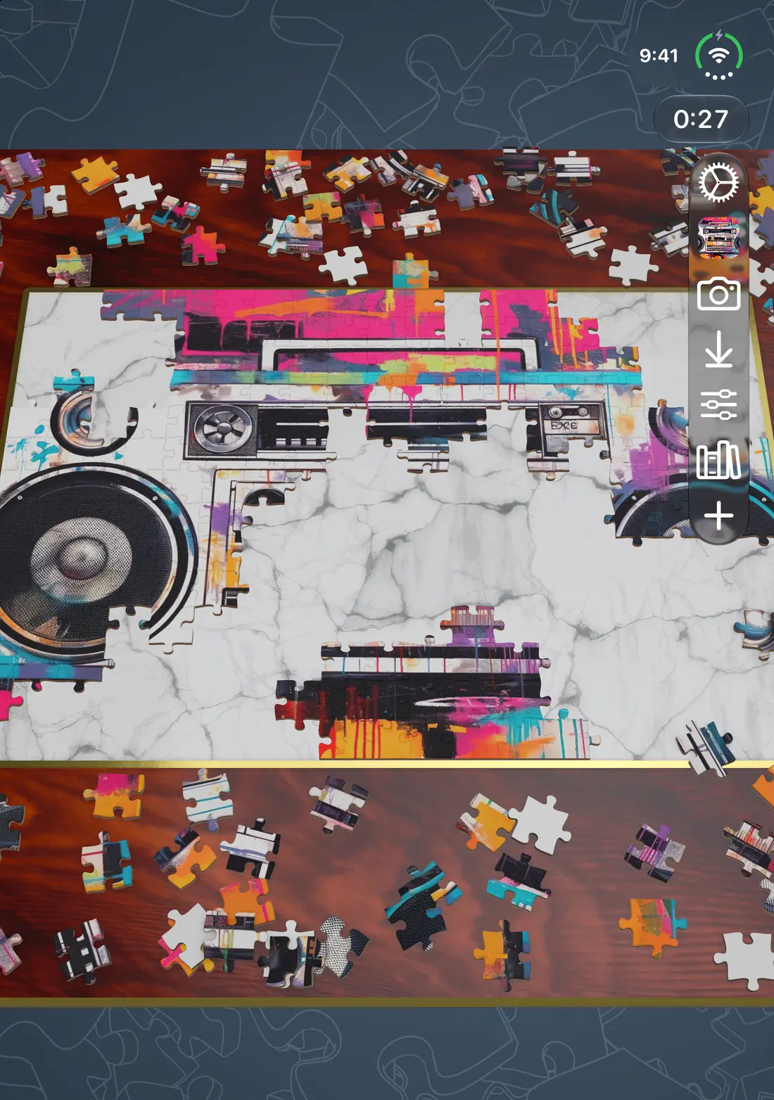 A boombox puzzle in progress on iPhone Duo with the device open, with a timer at the top