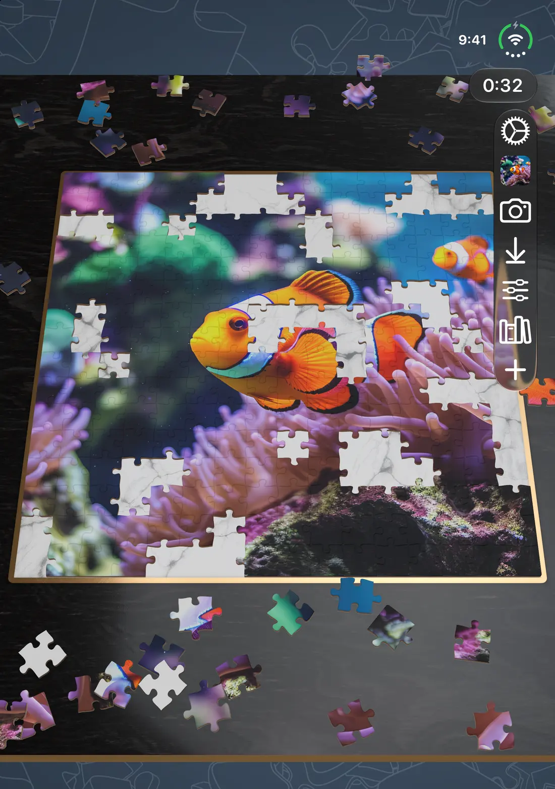 A clownfish puzzle being assembled on iPhone Duo with the device open