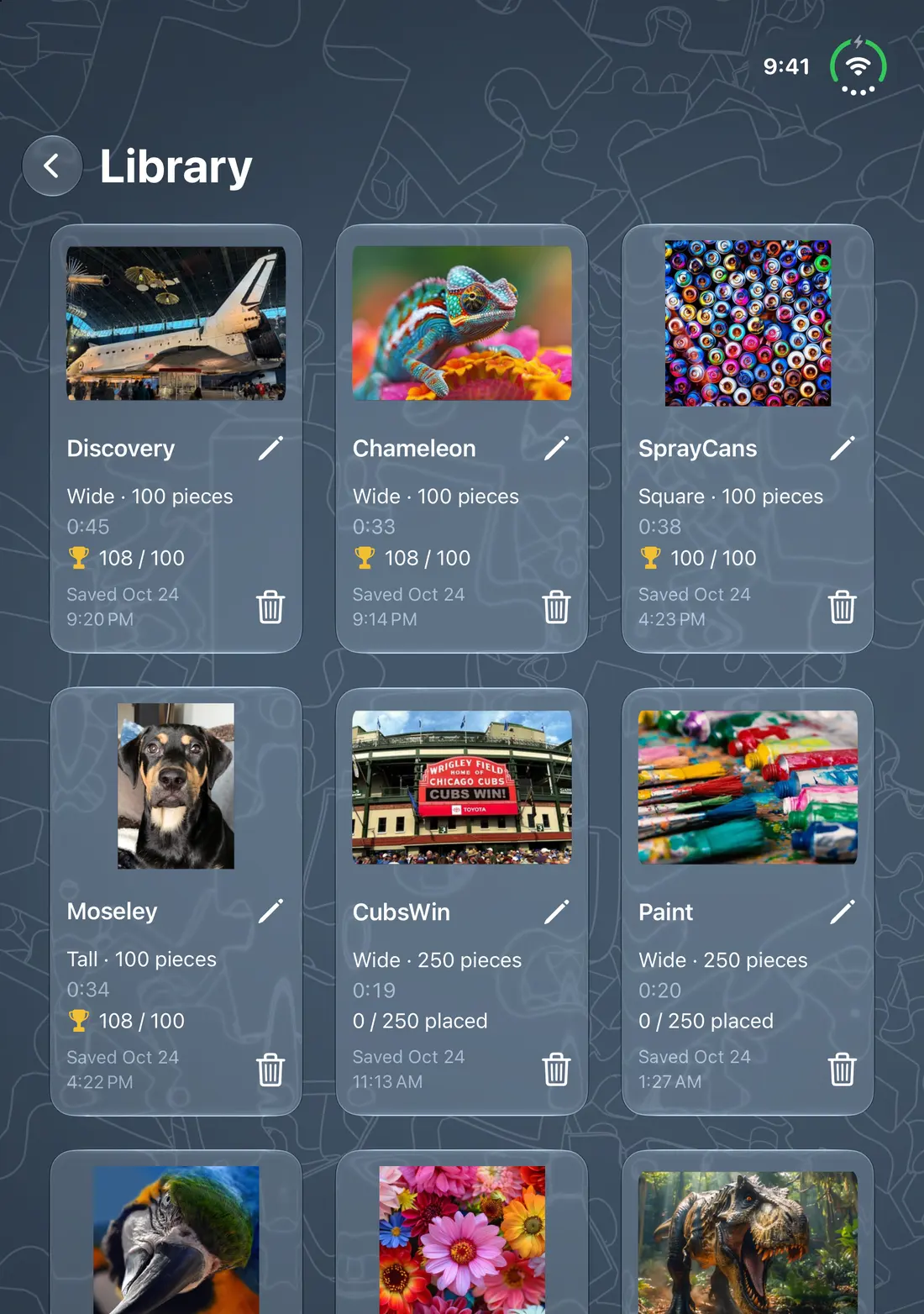 The Real Puzzler Library on iPhone Duo with the device open, showing saved puzzles as cards