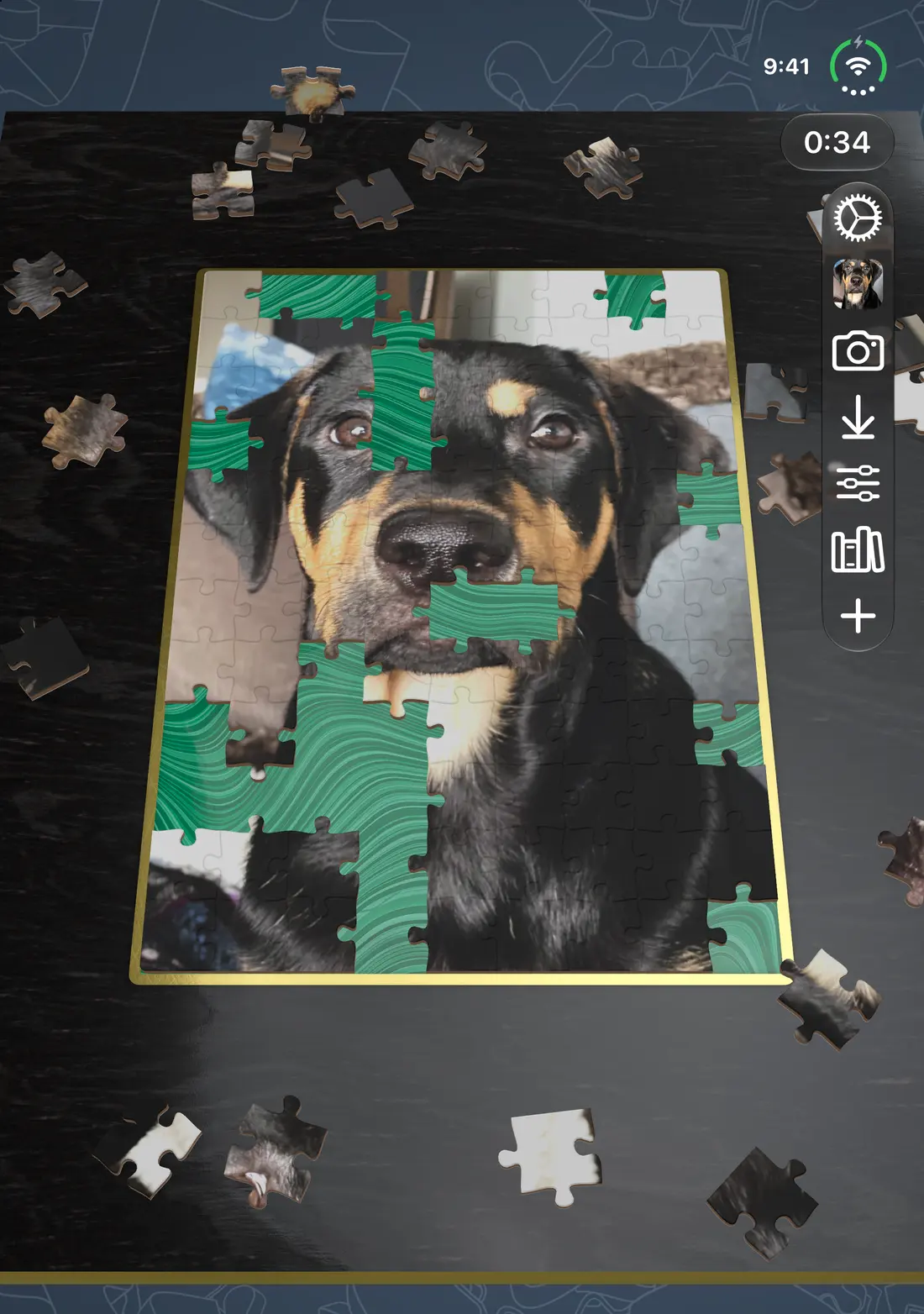 A puzzle of a dog being assembled on iPhone Duo with the device open